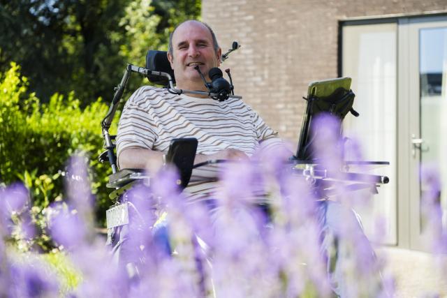 Man in wheelchair with chin control